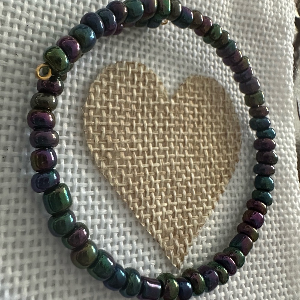 Hematite sea beads memory wire bracelet. Optional charms.